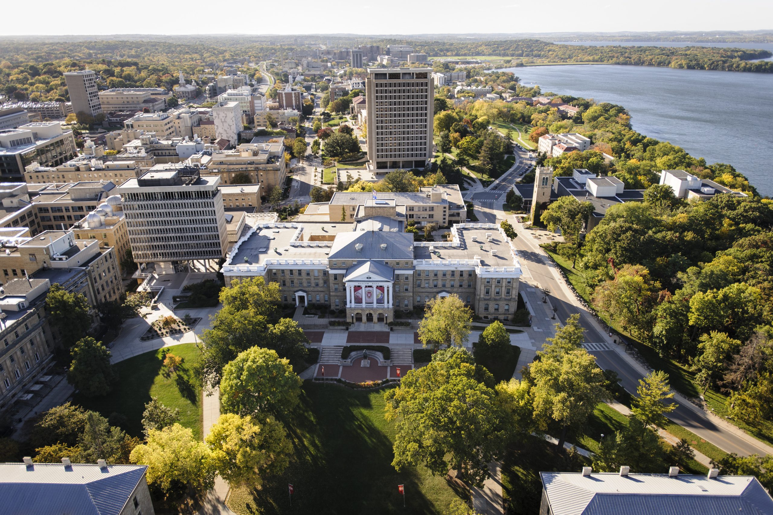 An overhead view of the UW–Madison campus, overlooking the main administrative building, Bascom Hall, and the west side of campus, including Lake Mendota.